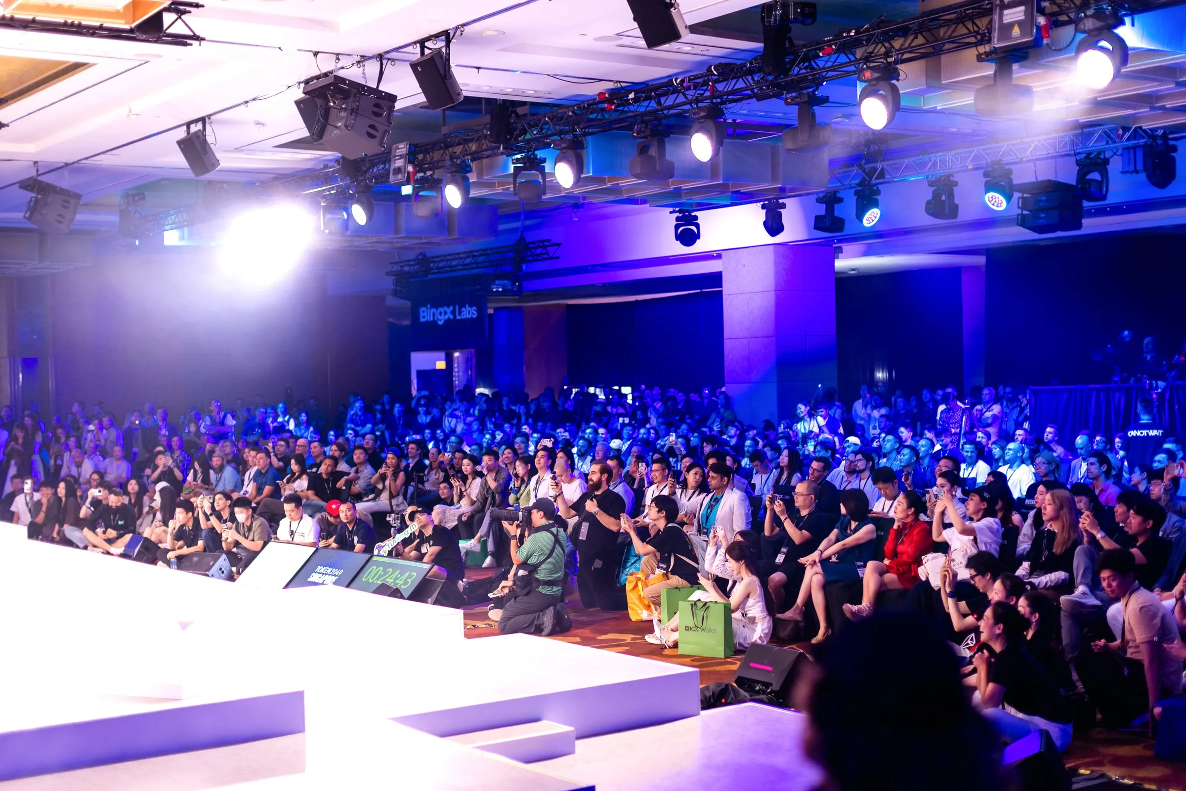 The crowd filling the hall to the back wall
