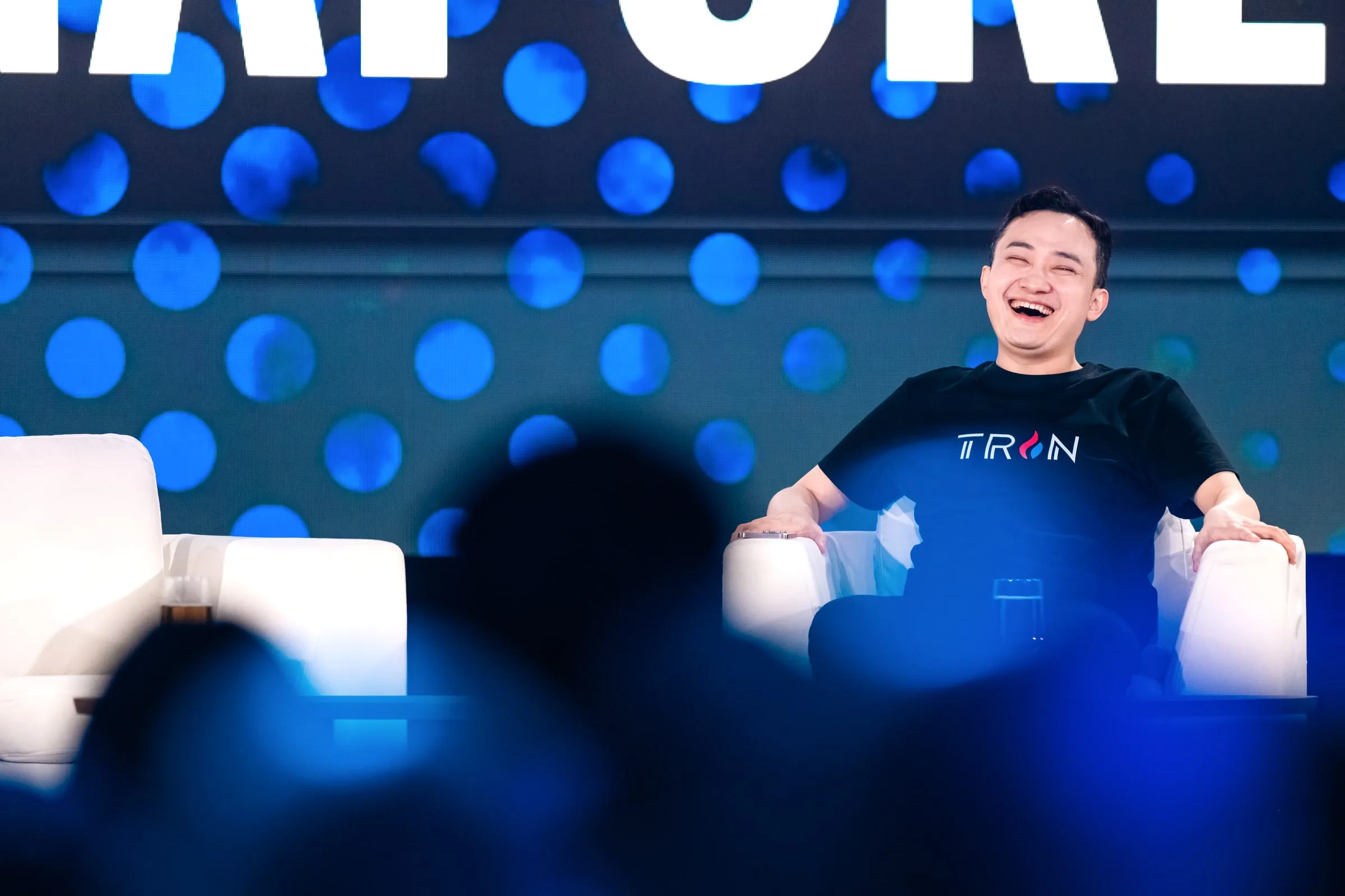 Justin Sun laughing during his roast